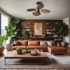 a living room filled with lots of furniture and plants on top of a wooden table