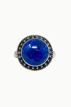 Aurora is a beautiful ring featuring a smooth round cushion cut Lapis Lazuli nestled in a finely detailed, sterling silver frame. Aurora is the perfect pick-me-up when you need that extra sparkle with it's ethereal, vintage-inspired design in silver. Authentic Sivalya Lapis Lazuli Lapis Lazuli: Inner Power - Wisdom - Manifestation Hallmarked Metal: 925 Sterling Silver Gemstone Size: 10mm x 10mm Cut: Round Shaped Smooth Cabochon Classic Sterling Silver Engraved Ring With Gemstone, Classic Rings With Round Stone Stamped 925, Classic Stamped 925 Silver Ring, Elegant Engraved Cabochon Ring, Classic Engraved Gemstone Ring, Classic Engraved Ring With Gemstone, Classic Dome Ring With Gemstone And Round Band, Round Sapphire Ring In Sterling Silver Stamped 925, Elegant Round Sapphire Ring With Large Stone