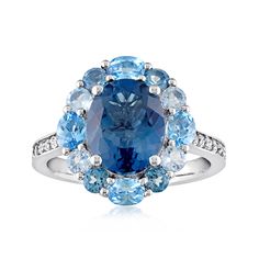 Ross-Simons - 5.10ct t. w. Tonal Blue Topaz Ring, .10ct t. w. White Topaz. Size 8. Garner a big gemstone look for a nice price! Beautiful in blue, our cocktail ring sports a sizable 3.60 carat oval London blue topaz centerpiece haloed in a lush cluster of 1.50 ct. t. w. multi-shaped Swiss, sky and London blue topaz. Crafted in polished sterling silver with .10 ct. t. w. white topaz rounds that spark the slender shank. 5/8" wide. White and tonal blue topaz ring. Blue Topaz birthstones are the per Blue Topaz Halo Ring, Blue Topaz Rings, Ring Redesign, Witcher Geralt, Topaz Rings, The Witcher Geralt, Frame Ring, Topaz Birthstone, The Gold Rush