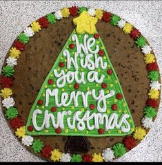 a decorated cookie with the words we wish you a merry christmas