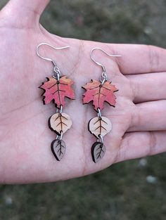 Introducing these stunning Leaves Wooden Earrings, perfect for adding a touch of nature to any outfit. Crafted from high-quality wood, these earrings are durable and lightweight, making them comfortable to wear all day long.  Made in three different designs: Leaves wooden Earrings Style #1 made with mahogany, cherry and walnut wood - Length 1.5" Drop length with ear wire hooks 2.25" Leaves wooden Earrings Style #2 made with mahogany, cherry and walnut wood - Length 1.5" Drop length with ear wire Everyday Leaf-shaped Jewelry With Matching Earrings, Nature-inspired Dangle Earrings, Nature-inspired Hypoallergenic Dangle Earrings, Nature-inspired Hypoallergenic Leaf Earrings, Hypoallergenic Leaf-shaped Nature-inspired Jewelry, Everyday Nature-inspired Leaf Jewelry, Nature-inspired Leaf Earrings For Everyday, Nature-inspired Leaf Jewelry For Everyday, Wooden Earrings