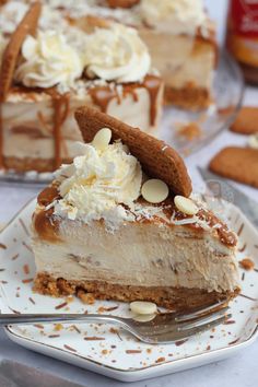 a slice of cheesecake on a plate with a fork next to the rest of the cake