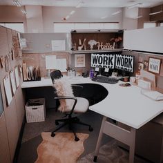 an office cubicle with a desk and chair