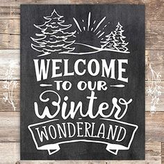 a black and white sign that says welcome to our winter wonderland with trees on it