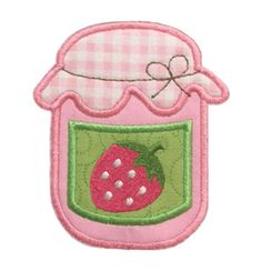 a pink and green patch with a strawberry in a jar on the front, embroidered onto it