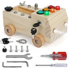 a wooden toy car with tools and screws