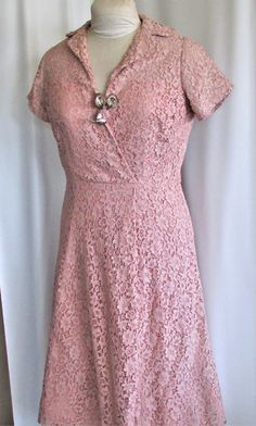 "PRETTY IN PINK LACE A dress to wear to a wedding, it is vintage elegant for the mother of the bride or the bride herself for a more casual affair, vintage themed or contemporary. This is a dress that hasn't lost its' style. It is a mauve tinted pink lace with short sleeves, V-neck with a collar, semi full skirt and a metal side zipper. It is hemmed at the knee but has a lot of hem which tells me it was below the knee at one time and could easily be hemmed again for some tall or wanting a longer Bride Dress Up, Fifties Dress, Wedding Scroll, 1950's Dress, Vintage 1950s Dresses, 1960's Dress, 1980s Dresses, Lace Shift Dress, Antique Clothing