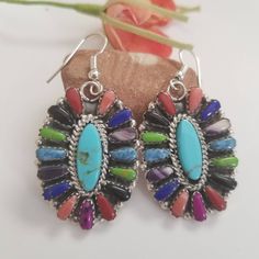 Beautiful Native American Inlay earrings. Handmade Lovely and elegant Southwestern look. Length: 2 inches includes the ear wire Width: 1 inch. Stone: reconstituted stones 👉Stone setting in each pair are different. Please message me if you have a preference for a specific pair. FREE shipping and I will ship USPS priority mail and insured. Please note that due to lighting affect and actual colors may be slightly different. I do my best to accurately photograph, the size may appear larger or small Southwestern Style Multicolor Nickel-free Jewelry, Bohemian Multicolor Multi-stone Earrings, Southwestern Multicolor Teardrop Earrings, Southwestern Style Drop Earrings, Multicolor Southwestern Teardrop Jewelry, Multicolor Southwestern Style Teardrop Jewelry, Southwestern Style Multicolor Teardrop Jewelry, Bohemian Multi-stone Dangle Earrings, Multicolor Southwestern Nickel-free Earrings