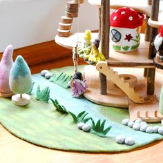 a play area with toys and accessories on the floor