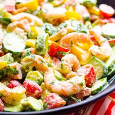 shrimp salad with avocado and tomatoes in a bowl