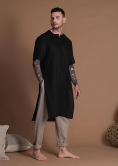 "A long linen shirt for men is made from lightweight linen to stay cool during summer. This tunic shirt is available in various colors. 🌿 DETAILS: - Regular fit men's tunic shirt - High side slits - Split neckline - Short sleeves - 100% Natural linen in lightweight weight (125gr/m2) - Wide color palette, color shown is BLACK 🌿 SIZING & FIT Please check OUR SIZE CHART carefully before you order. Feel free to contact me if you need advice on picking the right size or if you have any questions - Tunic Designs Men, Tunic Tops Men, Male Tunic Fashion, Linen Clothes Men, Tunic Men, Tunic For Men, Mens Linen Shirts Casual, Zen Clothing, Lounge Wear Men