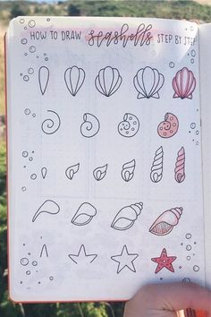 someone is holding up a notebook with doodles on it and the words how to draw seashells step by step