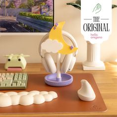 there is a computer mouse and keyboard on the desk next to an advertisement for the original