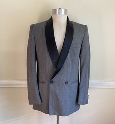 "Vintage Tuxedo Jacket Gray w Black Flecks / Semi Sheen Gray Speckled Black Dinner Tux Jacket / Chest  \" Length   \"  Vintage Tuxedo Jacket in a gunmetal silver gray...Features a textured fabric in shades of gray with black flecks and a very slight sheen that's not quite Sharkskin...The classic style features padded shoulders, a black Satin shawl collar, a 2 button double-breasted front that closes with one black button & one more front adjacent button (2 total front buttons- there's an inside Black Tuxedo Style Outerwear With Shawl Collar, Black Single Breasted Blazer With Shawl Collar, Black Single-breasted Blazer With Shawl Collar, Black Tuxedo With Shawl Collar For Winter, Black Shawl Collar Tuxedo For Winter, Fitted Stand Collar Outerwear For Semi-formal Occasions, Semi-formal Fitted Outerwear With Stand Collar, Fitted Gray Outerwear For Semi-formal Occasions, Winter Fitted Tuxedo With Shawl Collar