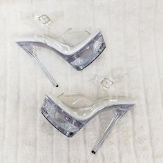 6 1/2" (165mm) Heel, 1 3/4" (44mm) Cut Out Platform Ankle Strap Sandal Featuring Rhinestones Covering The Entire Outer Platform Cut-Out Area New In Box True Fit Us Sizes Silver Platform Heels For Wedding, Silver Platform Heels With Pointed Toe, Clear Heels With Rhinestones And Ankle Strap, Clear Rhinestone High Heels, Glamorous Sparkling Clear Heels, Sparkling Clear Party Heels, Glamorous Metallic Silver Heels With 4-inch Heel, Glamorous Clear Heels With Rhinestones, Silver Heels With Bling And Round Toe