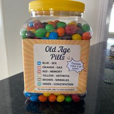 a jar filled with gummy bears sitting on top of a counter