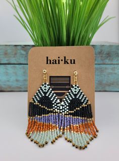 These abstract desert-scape beaded fringe earrings are stunning! They exude eighties and boho vibes, making them a memorable fashion statement. The pair include 1,348 Miyuki Delica seed beads handwoven woven one by one. Each earring measures approximately 2.9" in length. This is an original Haiku By Jennifer design. Lightweight and breezy, you are sure to have fun with this pair! Your purchase includes a lovely natural cotton jewelry pouch and is perfect for gifting. Handwoven Earrings, Cotton Jewelry, Beaded Fringe Earrings, Art Earrings, Desert Sunset, Beaded Earrings Patterns, Jewelry Design Earrings, Beaded Fringe, Earring Patterns