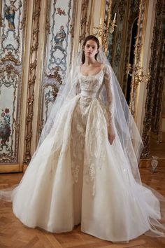 a woman in a wedding dress with a veil on her head