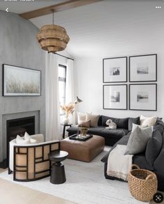 a living room filled with furniture and pictures on the wall