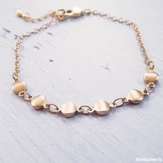 Beautiful dainty bracelet, this tiny coin bracelet is made with a dainty, yet durable, 18k gold plated coins and chain and it's perfect for layering with other chain bracelets or bangle bracelets (sold separately). ✤Small coin chain - 18K high-quality Gold plated Total length: 6//6.5//7//7.5//8 inches with an extension of 1.5 inches ✤If you need a different size please send me a message. Feel free to contact me for details & options. ♥All items are packed in an elegant jewelry box and ready Elegant Gold Nickel-free Chain Bracelet, Elegant Nickel-free Brass Chain Bracelet, Dainty Nickel-free Chain Bracelet For Everyday, Dainty Nickel-free 14k Gold-filled Bracelets, Gold Nickel-free Chain Bracelet For Everyday, Dainty 14k Gold-filled Nickel-free Bracelet, Dainty 14k Gold Filled Nickel-free Bracelet, Adjustable Gold Plated Dainty Chain Bracelet, Dainty Adjustable Gold Chain Charm Bracelet