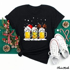 Olivia Mark - Short-Sleeved Black Tee with Christmas Snowman Wine Glass Print Black Holiday Tops For New Year, Holiday Black Short Sleeve Tops, Black Short Sleeve Holiday Tops, Black Crew Neck T-shirt For Holidays, Black Crew Neck Top For New Year, Black Winter Holiday T-shirt, Casual Black Tops For New Year, Black Crew Neck Christmas T-shirt, New Year Black Crew Neck T-shirt