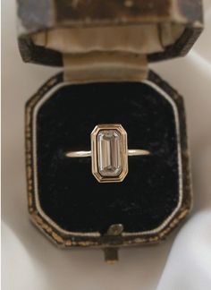 an antique diamond ring in a velvet box