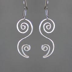 "This unique floral dangling earrings are handmade either from sterling silver. The principles of beauty and grace realized in serpentine lines. S curves modulate from one gradient to another. The \"S\" curves signify liveliness and activity and excite the attention of the viewer. They are \"The Line of Beauty\" The Length of the earrings is 1 inches, 25mm, excluding the earring hook. ;-) My contact number: 909-822-8348. Please contact me if you would like to order multiples or customize a desig Modern Twist Swirl Jewelry As Gift, Sterling Silver Swirl Jewelry Gift, Modern Twist Swirl Jewelry For Gift, Sterling Silver Swirl Jewelry As A Gift, Silver Swirl Jewelry For Gift, Elegant Swirl Wire Wrapped Earrings, Swirl Shaped Sterling Silver Earrings For Gifts, Sterling Silver Swirl Jewelry With Matching Earrings, Sterling Silver Swirl Earrings For Gift