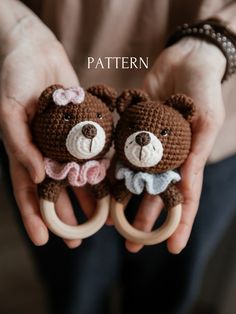 two crocheted teddy bears are held in their hands