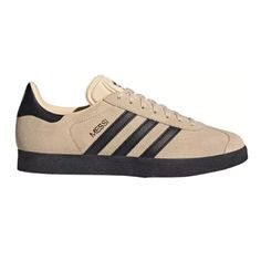 Adidas Gazelle Messi Shoes Color: Tan/Black Design: These Adidas Gazelle Football Shoes Flash The Goat's Iconic Logo On The Heel And A Trefoil On The Tongue Timeless Street Classic Shoe Built On A Low-Profile Ultra-Soft Suede Upper Leather Upper, T-Toe And Molded Tongue Keep Things Comfortable And Classic While You Represent Trefoil On Tongue, Trefoil On Heel Tab, Gold-Foil Gazelle Branding On The Lateral Side, Adidas Branding On Sockliner And Serrated Three Stripes Contains At Least 20% Recycle Messi Shoes, Adidas Branding, Football Shoes, Iconic Logo, Shoes Color, Adidas Gazelle, Classic Shoes, Soft Suede, Black Design