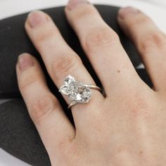 This adjustable ring has two different hand-carved flowers perched on top of a smooth silver band. There's a gap in the band between the flowers, giving them a light, floating appearance. There are little silver beads in their centers and at the tips of their petals. The flowers will drift apart on larger sizes and stack on top of each other in smaller sizes. Made from solid recycled sterling silver, please inquire about 14K.Flowers are 9 and 12mm along their diagonals. Carved Flowers, Spoon Rings, Diy Rings, Threader Earrings, Stone Design, Recycled Sterling Silver, Metal Bracelets, Flower Ring, Gorgeous Earrings