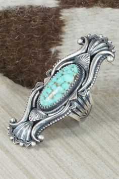 This Dry Creek turquoise and sterling silver ring was made by Navajo silversmith Derrick Gordon. The back is signed Derrick and stamped sterling.Size: 8.75Length: 2 1/2"Width: 1"Free shipping on all orders! We ship with USPS and always include tracking. All orders ship within a day of payment.Returns are accepted up to 30 days after you receive your order. Just send us a message. Our shop offers cash back or store credit. The item must be returned in new condition. Western Sterling Silver Turquoise Ring With Patina, Western Sterling Silver Turquoise Concho Ring, Collectible Western Style Turquoise Ring Stamped 925, Southwestern Stamped Turquoise Ring, Western Sterling Silver Turquoise Ring, Turquoise Wedding Rings, Acdc Angus Young, Acdc Angus, Angus Young