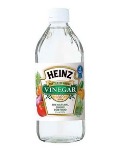 a bottle of vinegar water on a white background