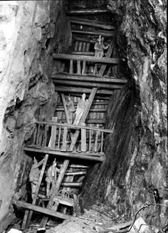 an old black and white photo of stairs leading up to the top of a mountain