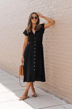 This Black Button Down Midi Dress is a sophisticated and versatile piece perfect for a variety of occasions! Made from a blend of linen and rayon, this dress combines breathability with a smooth, soft texture, ensuring comfort and style. Features a notched collar, a button down front, and a tie belt that cinches at the waist, accentuating your figure and adding a customizable fit. Style it with flat sandals and a wide-brimmed hat for a comfortable yet stylish weekend look! Casual Everyday Dresses, Button Down Midi Dress, Brimmed Hat, Short Summer Dresses, Work Dresses, Professional Dresses, Button Down Dress, Wide Brimmed Hats, Everyday Dresses