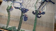 a close up of a piece of cloth with flowers on it and some wires attached to the fabric