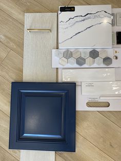 the blue frame is sitting on the floor next to other items that have been placed around it