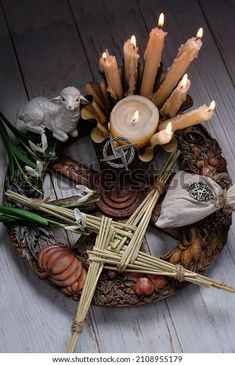 a wicker bowl with candles and other items on it