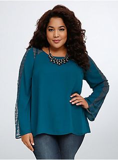 <p>This eye-popping blouse is a stunning staple. Gorgeous and rich teal georgette covers the long sleeved style (drawing all eyes on you), while delicate and lovely lace insets panel the sleeves and shoulders. A button back amps up the breathability.</p>  <p> </p>  <p><b>Model is 5’10”, size 1</b></p>  <ul> 	<li>Size 1 measures 29 1/4" from shoulder</li> 	<li>Polyester/nylon</li> 	<li>Hand wash cold, dry flat</li> 	<li>Imported plus size blouse</li> </ul> Ripped Jeans Look, Plus Size Blouse, Georgette Blouse, Elegant Blouses, Plus Size Fashion For Women, Lace Inset, Feel Pretty, All Eyes, Curvy Outfits