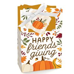 a gift bag with the words happy friends giving written on it and pumpkins around it