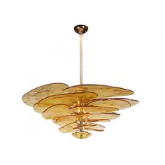 a chandelier hanging from the ceiling with glass petals in gold and brown tones