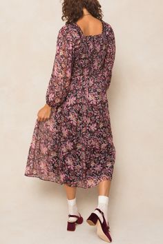 Searching for modest long sleeve dresses? Introducing our Sasha Dress - a playful and flowy addition to your wardrobe. Made with black chiffon fabric and adorned with purple florals, this midi-length women's dress features a square neckline with ruffle detailing, a hidden back zipper, smocking, and ruching. All of these unique details and more make this dress stand out. Perfect for fall and beyond. Flowy Purple Maxi Dress For Fall, Feminine Fall Chiffon Midi Dress, Purple Flowy Long Sleeve Midi Dress, Purple Long Sleeve Flowy Midi Dress, Purple Chiffon Midi Dress, Feminine Chiffon Midi Dress For Fall, Modest Long Sleeve Purple Dresses, Purple Floral Print Long Sleeve Midi Dress, Purple Long Sleeve Midi Dress With Floral Print