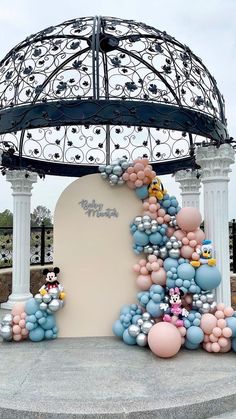 balloon art at the entrance to mickey mouse's castle