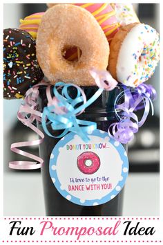 a jar filled with donuts and sprinkles on top of a table