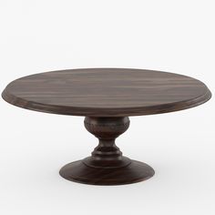 a round wooden table with two pedestals on the top and one in the middle