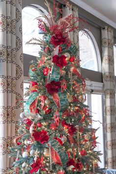 a decorated christmas tree with red and green ornaments