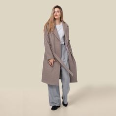 Dana offers an update to the classic wool trench coat with tie closure, a gorgeous length, and an interior cell phone pocket. The stylish cut of this professional piece is sure to keep you warm and fashionable on those chilly spring mornings with a waist button and adjustable sash. DETAILS & CARE Extremely soft, heather wool blend in classy shades Waist button fastener and tie waist belt Two patch pockets at front and interior pocket sewn in lining Approx. 39.5 inches long from center back t Spring Coat, Wool Trench Coat, Fall Coat, Waist Belt, Duster Coat, Wool Blend, Trench Coat, Cell Phone, Normcore