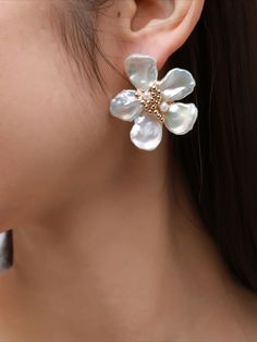 Introducing the COCOKIM Falling Blossoms Series: Petal Earrings. These earrings embody the delicate beauty of falling flower petals in a captivating design. Each earring features intricately crafted petals, delicately arranged to evoke the serene charm of blossoming gardens. The gentle sway of the petals adds movement and grace to your look, while the timeless design ensures versatility for any occasion. Metal: 14K Gold Filled Gemstone: Freshwater Pearl Flowers Diameter: 40mm Gold Elegant Flower Earrings With 3d Flowers, Elegant Gold Flower Earrings With 3d Details, 3d Flower Shaped Earrings, Formal Flower-shaped Earrings, Petal-shaped Jewelry With Matching Earrings, Delicate Petal-shaped Earrings With Flower Charm, Gold Petal Earrings, Flower-shaped Earrings For Anniversary, Flower-shaped Earrings For Wedding