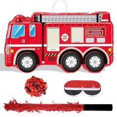 a paper firetruck cut out with red crayons next to it and other items