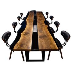 a long wooden table with chairs around it