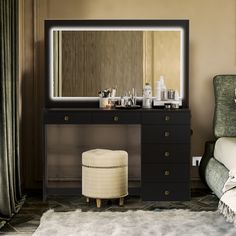 a dressing table with a mirror and stool